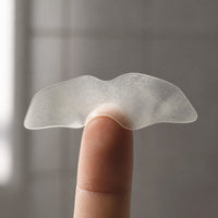 A peeled hydrocolloid Pull Patch on a fingertip